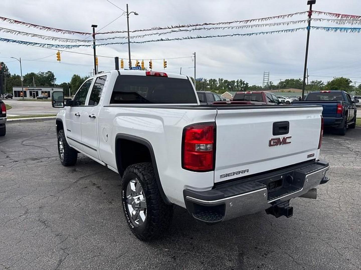 2016 WHITE /BROWN/TAN GMC Sierra 2500HD SLT Double Cab 4WD (1GT22TE86GZ) with an 6.6L V8 OHV 16V DIESEL engine, 6A transmission, located at 3304 Woodville Road, Northwood, OH, 43619, (419) 210-8019, 41.612694, -83.480743 - Your #1 Destination for Auto Loans and mdash;No Matter Your Credit!At our dealership, we believe everyone deserves the opportunity to drive their dream car and mdash;whether you have good credit, bad credit, or no credit at all. With a wide selection of hundreds of cars, trucks, and SUVs, you'll fin- Photo#2