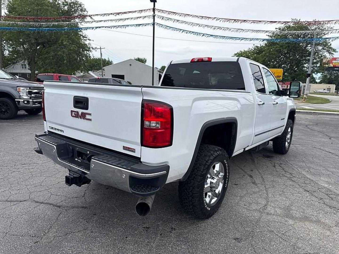 2016 WHITE /BROWN/TAN GMC Sierra 2500HD SLT Double Cab 4WD (1GT22TE86GZ) with an 6.6L V8 OHV 16V DIESEL engine, 6A transmission, located at 3304 Woodville Road, Northwood, OH, 43619, (419) 210-8019, 41.612694, -83.480743 - Your #1 Destination for Auto Loans and mdash;No Matter Your Credit!At our dealership, we believe everyone deserves the opportunity to drive their dream car and mdash;whether you have good credit, bad credit, or no credit at all. With a wide selection of hundreds of cars, trucks, and SUVs, you'll fin- Photo#4