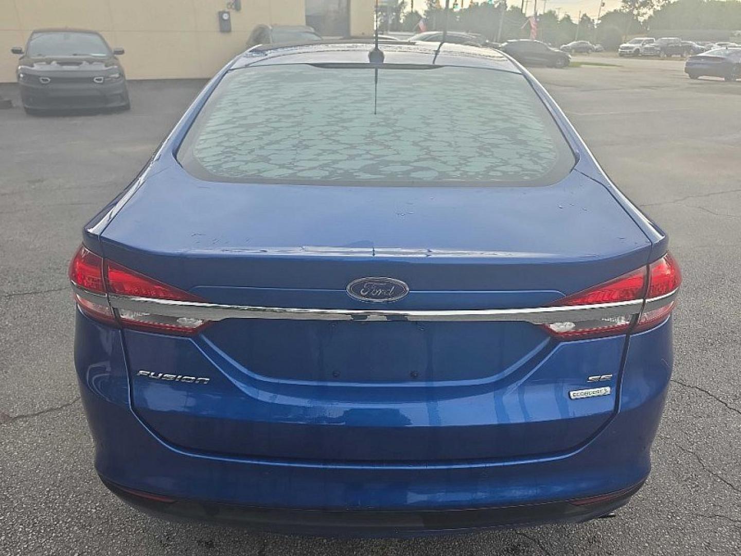 2017 BLUE /BLACK Ford Fusion SE (3FA6P0HD0HR) with an 1.5L L4 DOHC 16V engine, 6A transmission, located at 3304 Woodville Road, Northwood, OH, 43619, (419) 210-8019, 41.612694, -83.480743 - Your #1 Destination for Auto Loans and mdash;No Matter Your Credit!At our dealership, we believe everyone deserves the opportunity to drive their dream car and mdash;whether you have good credit, bad credit, or no credit at all. With a wide selection of hundreds of cars, trucks, and SUVs, you'll fin- Photo#3