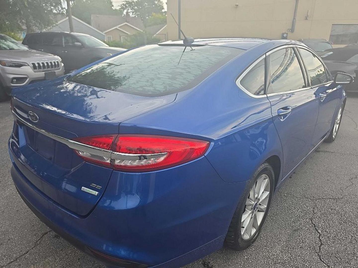 2017 BLUE /BLACK Ford Fusion SE (3FA6P0HD0HR) with an 1.5L L4 DOHC 16V engine, 6A transmission, located at 3304 Woodville Road, Northwood, OH, 43619, (419) 210-8019, 41.612694, -83.480743 - Your #1 Destination for Auto Loans and mdash;No Matter Your Credit!At our dealership, we believe everyone deserves the opportunity to drive their dream car and mdash;whether you have good credit, bad credit, or no credit at all. With a wide selection of hundreds of cars, trucks, and SUVs, you'll fin- Photo#4