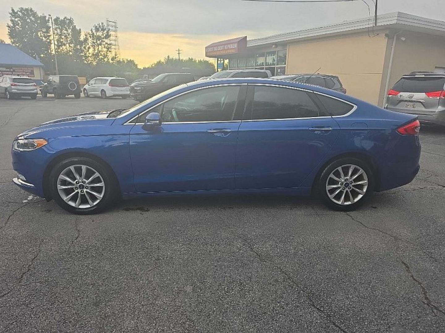 2017 BLUE /BLACK Ford Fusion SE (3FA6P0HD0HR) with an 1.5L L4 DOHC 16V engine, 6A transmission, located at 3304 Woodville Road, Northwood, OH, 43619, (419) 210-8019, 41.612694, -83.480743 - Your #1 Destination for Auto Loans and mdash;No Matter Your Credit!At our dealership, we believe everyone deserves the opportunity to drive their dream car and mdash;whether you have good credit, bad credit, or no credit at all. With a wide selection of hundreds of cars, trucks, and SUVs, you'll fin- Photo#1