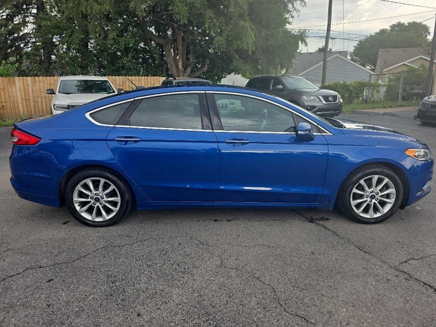 2017 BLUE /BLACK Ford Fusion SE (3FA6P0HD0HR) with an 1.5L L4 DOHC 16V engine, 6A transmission, located at 3304 Woodville Road, Northwood, OH, 43619, (419) 210-8019, 41.612694, -83.480743 - Your #1 Destination for Auto Loans and mdash;No Matter Your Credit!At our dealership, we believe everyone deserves the opportunity to drive their dream car and mdash;whether you have good credit, bad credit, or no credit at all. With a wide selection of hundreds of cars, trucks, and SUVs, you'll fin- Photo#5