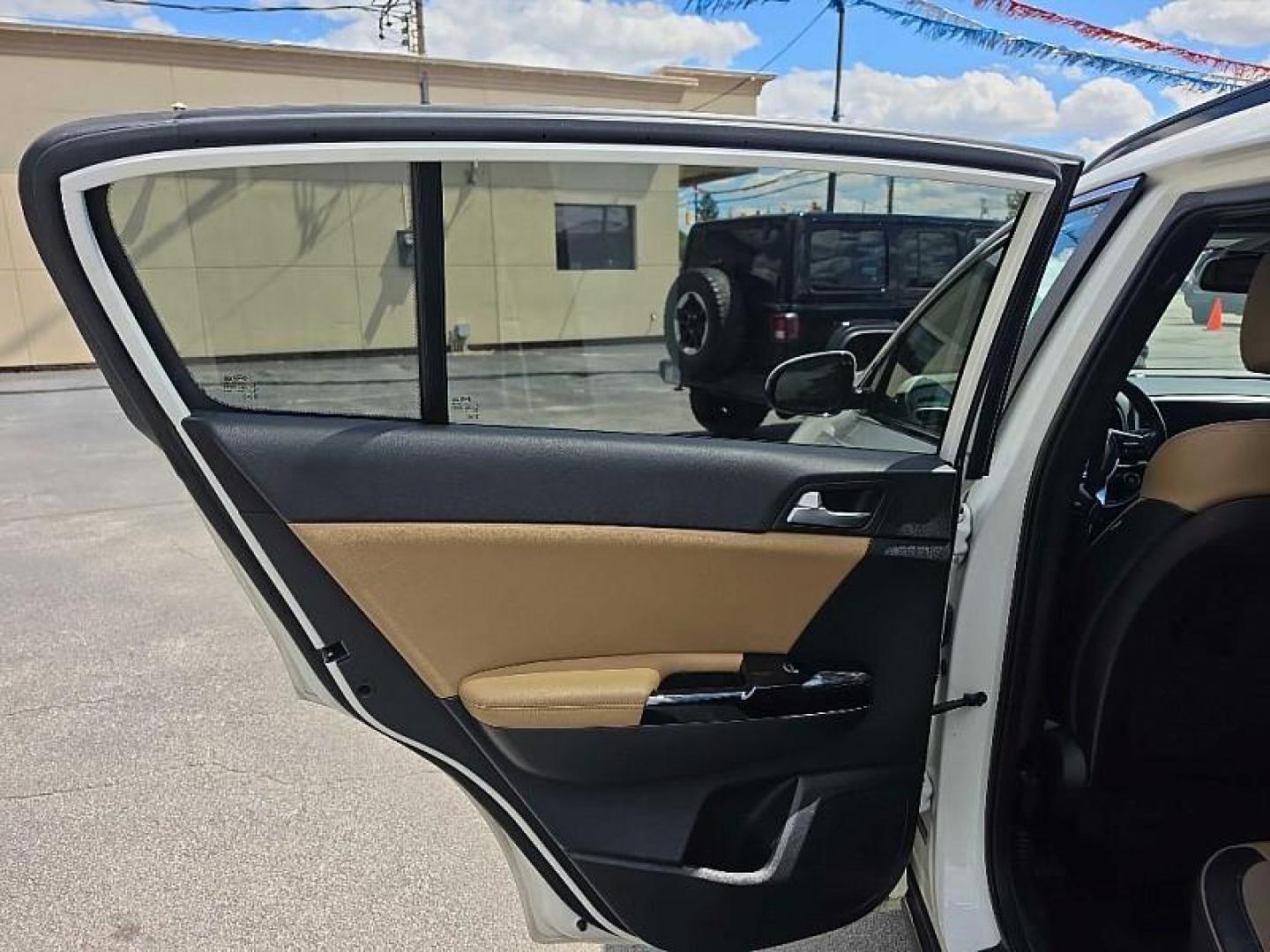2020 WHITE /TAN Kia Sportage SX AWD (KNDPRCA63L7) with an 2.0L L4 DOHC 16V engine, 6A transmission, located at 3304 Woodville Road, Northwood, OH, 43619, (419) 210-8019, 41.612694, -83.480743 - Your #1 Destination for Auto Loans and mdash;No Matter Your Credit!At our dealership, we believe everyone deserves the opportunity to drive their dream car and mdash;whether you have good credit, bad credit, or no credit at all. With a wide selection of hundreds of cars, trucks, and SUVs, you'll fin- Photo#10