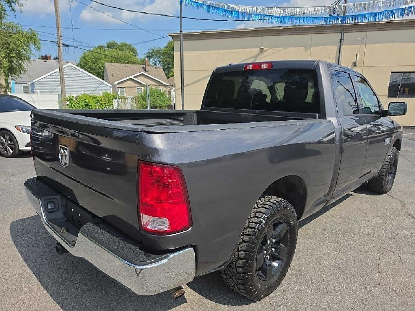 2016 GRAY /GRAY RAM 1500 Tradesman Quad Cab 4WD (1C6RR7FT9GS) with an 5.7L V8 OHV 16V engine, 6A transmission, located at 3304 Woodville Road, Northwood, OH, 43619, (419) 210-8019, 41.612694, -83.480743 - Your #1 Destination for Auto Loans and mdash;No Matter Your Credit!At our dealership, we believe everyone deserves the opportunity to drive their dream car and mdash;whether you have good credit, bad credit, or no credit at all. With a wide selection of hundreds of cars, trucks, and SUVs, you'll fin- Photo#4