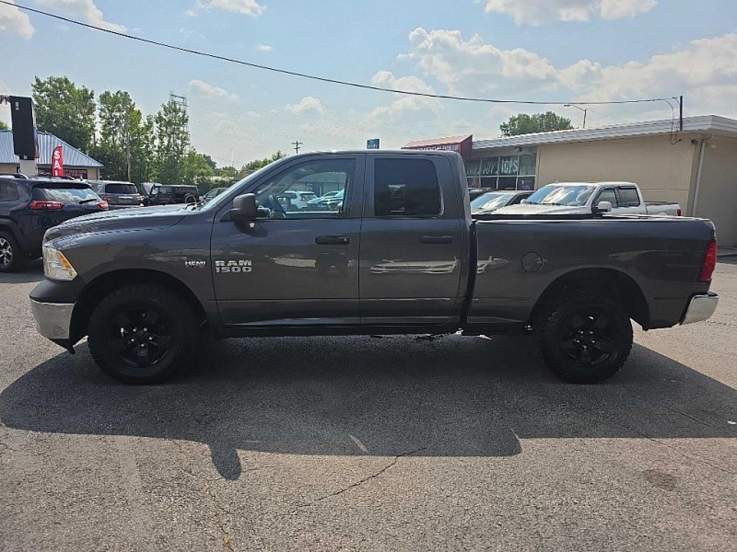 2016 GRAY /GRAY RAM 1500 Tradesman Quad Cab 4WD (1C6RR7FT9GS) with an 5.7L V8 OHV 16V engine, 6A transmission, located at 3304 Woodville Road, Northwood, OH, 43619, (419) 210-8019, 41.612694, -83.480743 - Your #1 Destination for Auto Loans and mdash;No Matter Your Credit!At our dealership, we believe everyone deserves the opportunity to drive their dream car and mdash;whether you have good credit, bad credit, or no credit at all. With a wide selection of hundreds of cars, trucks, and SUVs, you'll fin- Photo#1