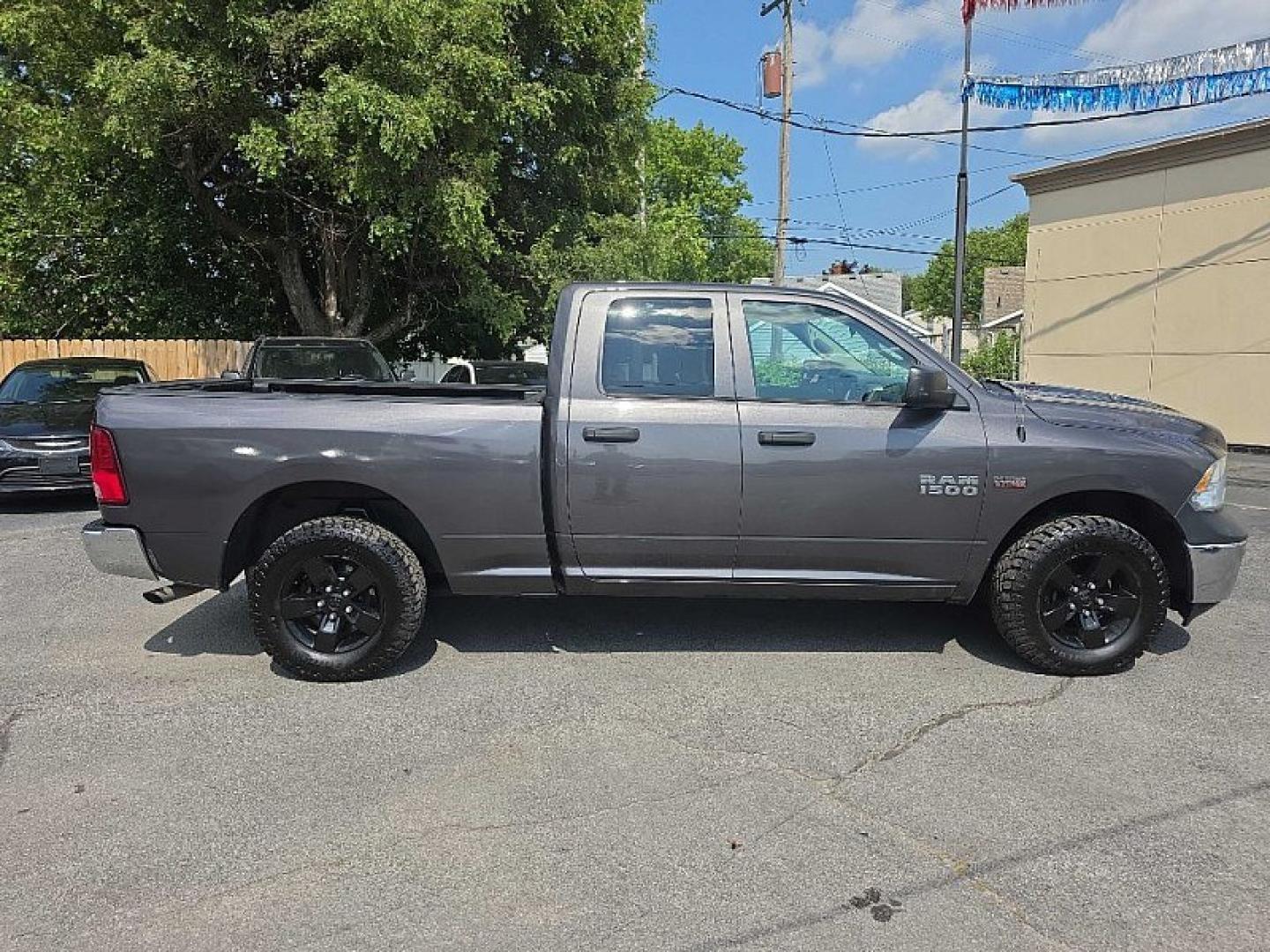 2016 GRAY /GRAY RAM 1500 Tradesman Quad Cab 4WD (1C6RR7FT9GS) with an 5.7L V8 OHV 16V engine, 6A transmission, located at 3304 Woodville Road, Northwood, OH, 43619, (419) 210-8019, 41.612694, -83.480743 - Your #1 Destination for Auto Loans and mdash;No Matter Your Credit!At our dealership, we believe everyone deserves the opportunity to drive their dream car and mdash;whether you have good credit, bad credit, or no credit at all. With a wide selection of hundreds of cars, trucks, and SUVs, you'll fin- Photo#5