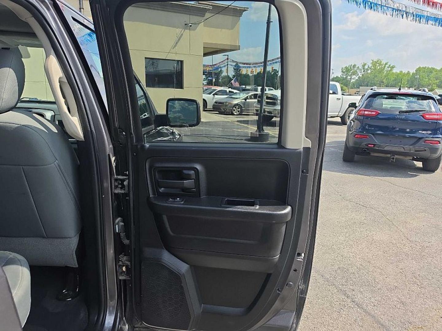 2016 GRAY /GRAY RAM 1500 Tradesman Quad Cab 4WD (1C6RR7FT9GS) with an 5.7L V8 OHV 16V engine, 6A transmission, located at 3304 Woodville Road, Northwood, OH, 43619, (419) 210-8019, 41.612694, -83.480743 - Your #1 Destination for Auto Loans and mdash;No Matter Your Credit!At our dealership, we believe everyone deserves the opportunity to drive their dream car and mdash;whether you have good credit, bad credit, or no credit at all. With a wide selection of hundreds of cars, trucks, and SUVs, you'll fin- Photo#12