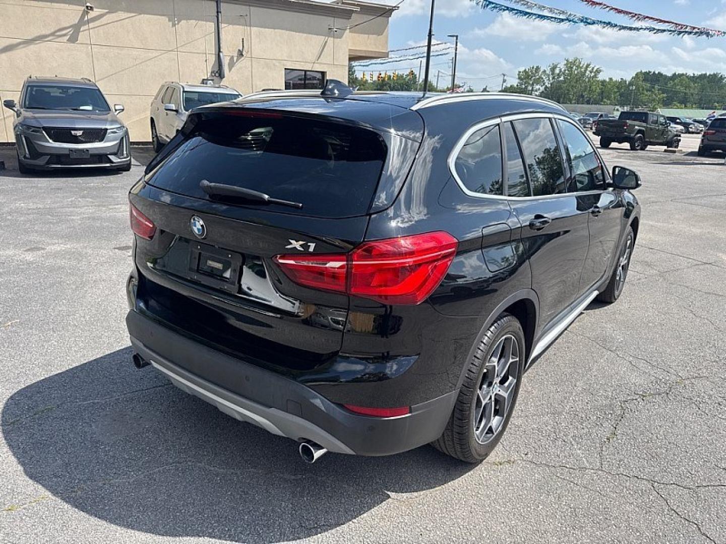 2017 BLACK /BLACK BMW X1 xDrive28i (WBXHT3Z34H4) with an 2.0L L4 DOHC 16V engine, 8A transmission, located at 3304 Woodville Road, Northwood, OH, 43619, (419) 210-8019, 41.612694, -83.480743 - Your #1 Destination for Auto Loans and mdash;No Matter Your Credit!At our dealership, we believe everyone deserves the opportunity to drive their dream car and mdash;whether you have good credit, bad credit, or no credit at all. With a wide selection of hundreds of cars, trucks, and SUVs, you'll fin- Photo#4