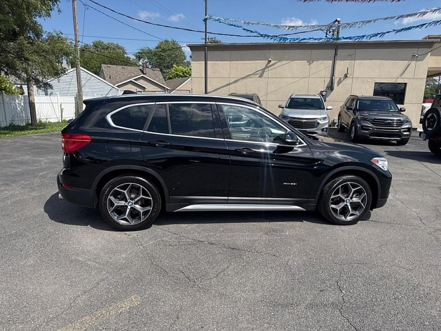 2017 BLACK /BLACK BMW X1 xDrive28i (WBXHT3Z34H4) with an 2.0L L4 DOHC 16V engine, 8A transmission, located at 3304 Woodville Road, Northwood, OH, 43619, (419) 210-8019, 41.612694, -83.480743 - Your #1 Destination for Auto Loans and mdash;No Matter Your Credit!At our dealership, we believe everyone deserves the opportunity to drive their dream car and mdash;whether you have good credit, bad credit, or no credit at all. With a wide selection of hundreds of cars, trucks, and SUVs, you'll fin- Photo#5