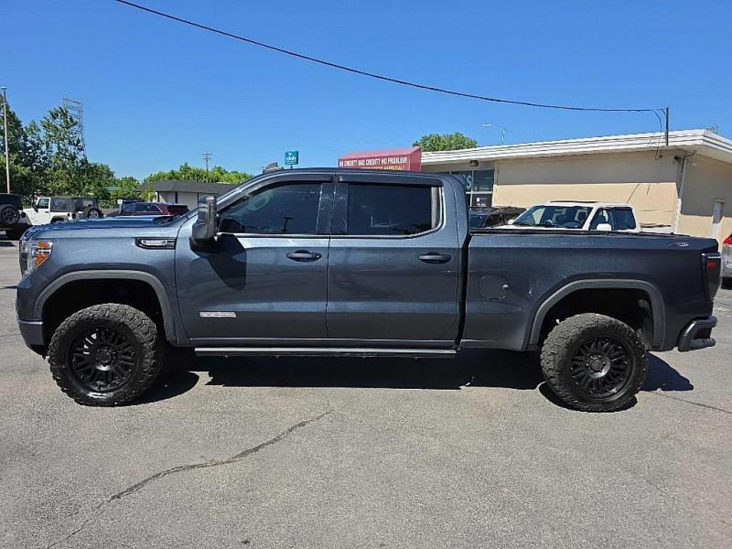 2021 GRAY /BLACK GMC Sierra 1500 Elevation Crew Cab Short Box 4WD (1GTU9CET3MZ) with an 3.0L L6 DOHC 24V DIESEL engine, 6A transmission, located at 3304 Woodville Road, Northwood, OH, 43619, (419) 210-8019, 41.612694, -83.480743 - Your #1 Destination for Auto Loans and mdash;No Matter Your Credit!At our dealership, we believe everyone deserves the opportunity to drive their dream car and mdash;whether you have good credit, bad credit, or no credit at all. With a wide selection of hundreds of cars, trucks, and SUVs, you'll fin- Photo#1