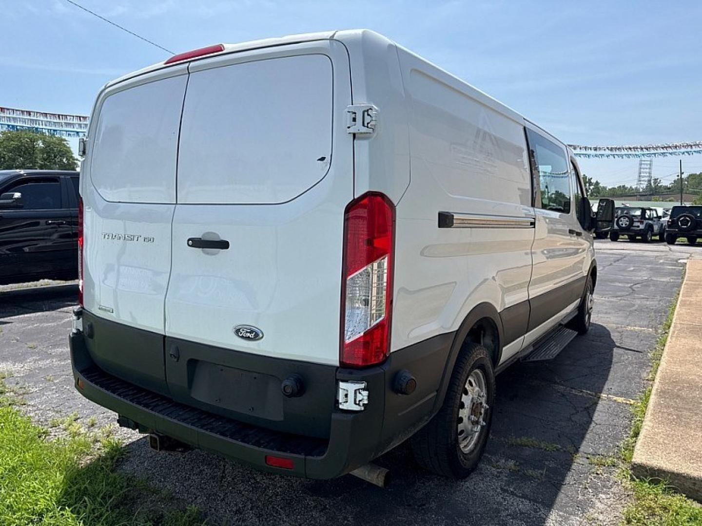 2020 WHITE /BLACK Ford Transit 150 Van Low Roof 60/40 Pass. 130-in. WB (1FTYE1ZG7LK) with an 3.5L V6 DOHC 24V engine, 6A transmission, located at 3304 Woodville Road, Northwood, OH, 43619, (419) 210-8019, 41.612694, -83.480743 - Your #1 Destination for Auto Loans and mdash;No Matter Your Credit!At our dealership, we believe everyone deserves the opportunity to drive their dream car and mdash;whether you have good credit, bad credit, or no credit at all. With a wide selection of hundreds of cars, trucks, and SUVs, you'll fin- Photo#4