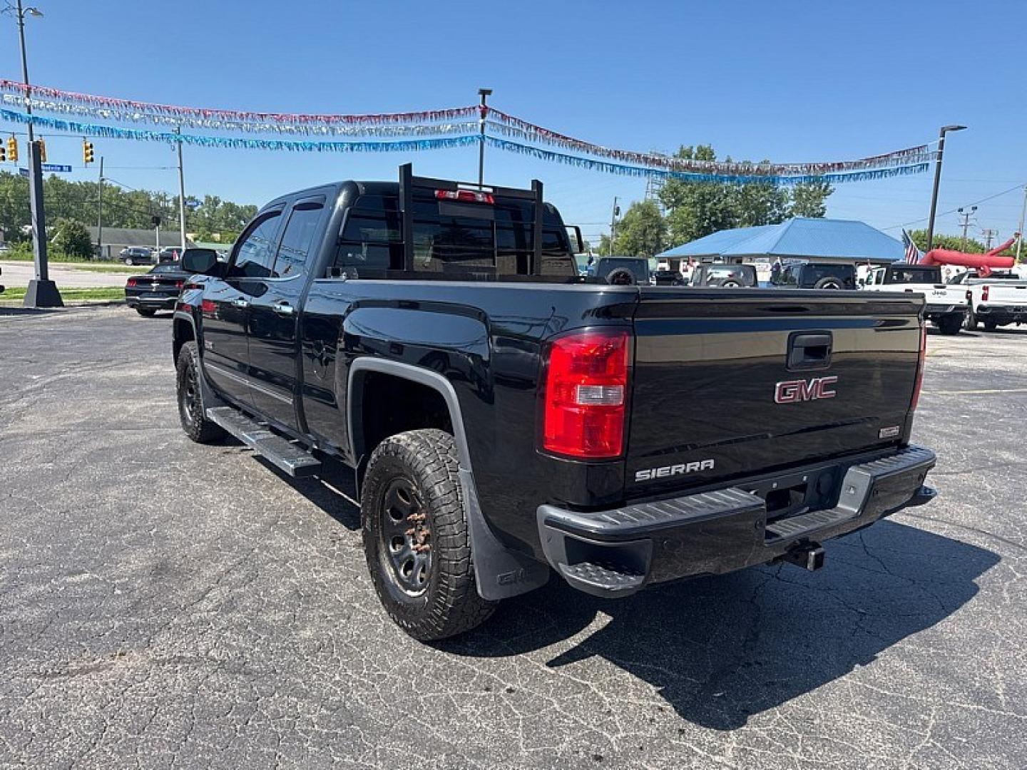 2013 BLACK /BLACK GMC Sierra 1500 SLT Ext. Cab 4WD (1GTV2VEC3EZ) with an 5.3L V8 OHV 16V engine, 6-Speed Automatic transmission, located at 3304 Woodville Road, Northwood, OH, 43619, (419) 210-8019, 41.612694, -83.480743- Photo#2