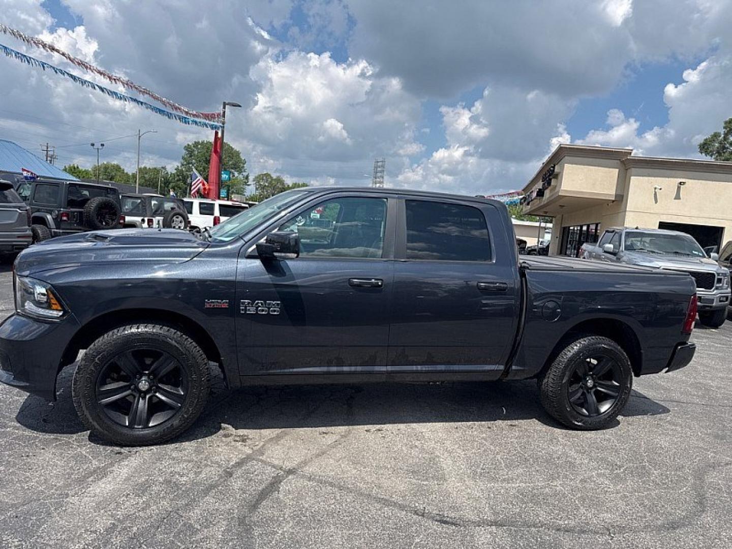 2016 GRAY /BLACK RAM 1500 Sport Crew Cab SWB 4WD (1C6RR7MT2GS) with an 5.7L V8 OHV 16V engine, 6A transmission, located at 3304 Woodville Road, Northwood, OH, 43619, (419) 210-8019, 41.612694, -83.480743 - Your #1 Destination for Auto Loans and mdash;No Matter Your Credit!At our dealership, we believe everyone deserves the opportunity to drive their dream car and mdash;whether you have good credit, bad credit, or no credit at all. With a wide selection of hundreds of cars, trucks, and SUVs, you'll fin- Photo#1
