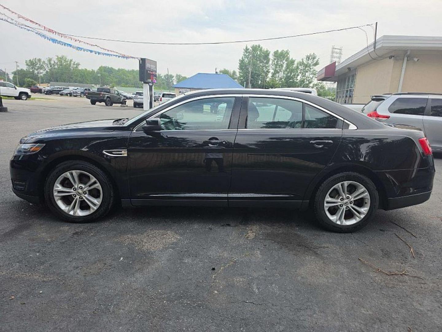 2018 BLACK /BLACK Ford Taurus SEL FWD (1FAHP2E83JG) with an 3.5L V6 DOHC 24V engine, 6A transmission, located at 3304 Woodville Road, Northwood, OH, 43619, (419) 210-8019, 41.612694, -83.480743 - Your #1 Destination for Auto Loans and mdash;No Matter Your Credit!At our dealership, we believe everyone deserves the opportunity to drive their dream car and mdash;whether you have good credit, bad credit, or no credit at all. With a wide selection of hundreds of cars, trucks, and SUVs, you'll fin- Photo#1