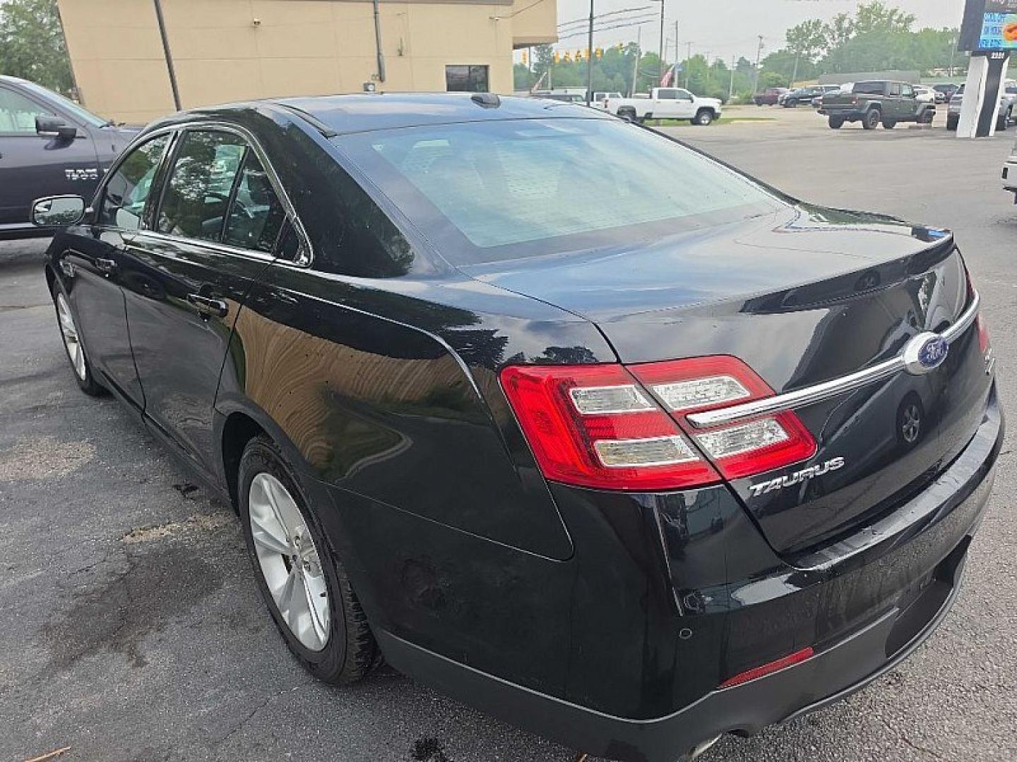 2018 BLACK /BLACK Ford Taurus SEL FWD (1FAHP2E83JG) with an 3.5L V6 DOHC 24V engine, 6A transmission, located at 3304 Woodville Road, Northwood, OH, 43619, (419) 210-8019, 41.612694, -83.480743 - Your #1 Destination for Auto Loans and mdash;No Matter Your Credit!At our dealership, we believe everyone deserves the opportunity to drive their dream car and mdash;whether you have good credit, bad credit, or no credit at all. With a wide selection of hundreds of cars, trucks, and SUVs, you'll fin- Photo#2