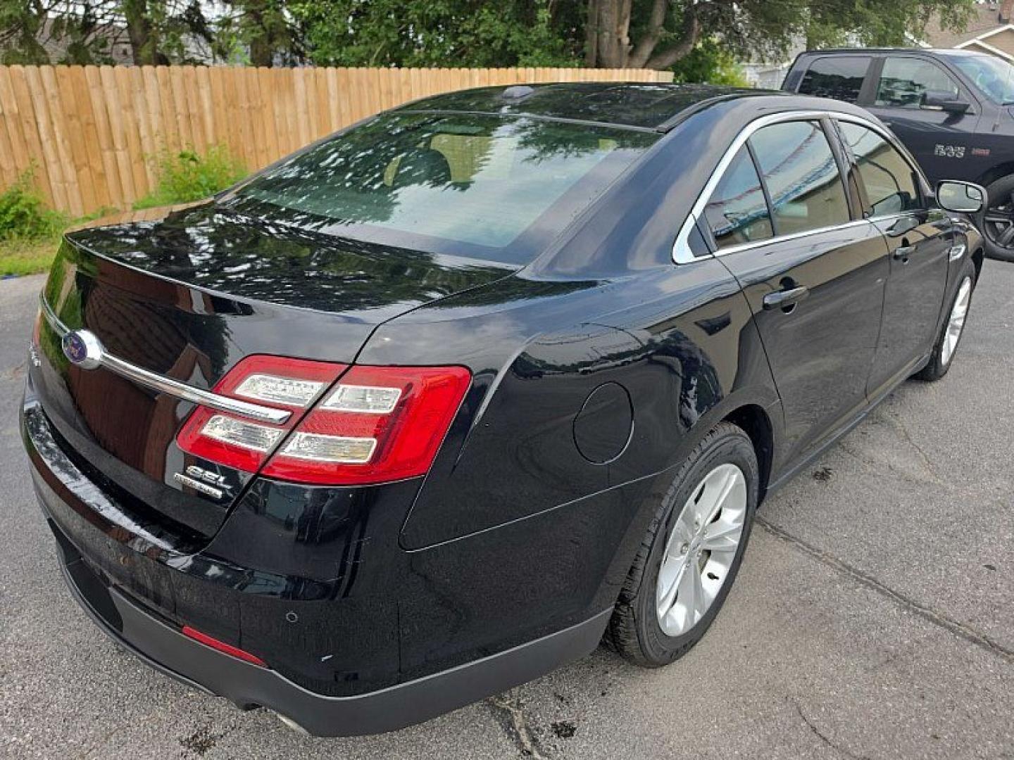 2018 BLACK /BLACK Ford Taurus SEL FWD (1FAHP2E83JG) with an 3.5L V6 DOHC 24V engine, 6A transmission, located at 3304 Woodville Road, Northwood, OH, 43619, (419) 210-8019, 41.612694, -83.480743 - Your #1 Destination for Auto Loans and mdash;No Matter Your Credit!At our dealership, we believe everyone deserves the opportunity to drive their dream car and mdash;whether you have good credit, bad credit, or no credit at all. With a wide selection of hundreds of cars, trucks, and SUVs, you'll fin- Photo#4