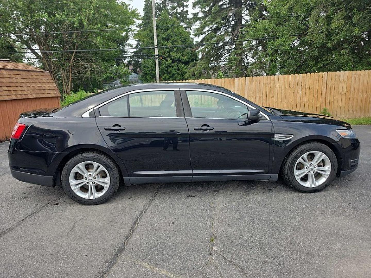 2018 BLACK /BLACK Ford Taurus SEL FWD (1FAHP2E83JG) with an 3.5L V6 DOHC 24V engine, 6A transmission, located at 3304 Woodville Road, Northwood, OH, 43619, (419) 210-8019, 41.612694, -83.480743 - Your #1 Destination for Auto Loans and mdash;No Matter Your Credit!At our dealership, we believe everyone deserves the opportunity to drive their dream car and mdash;whether you have good credit, bad credit, or no credit at all. With a wide selection of hundreds of cars, trucks, and SUVs, you'll fin- Photo#5