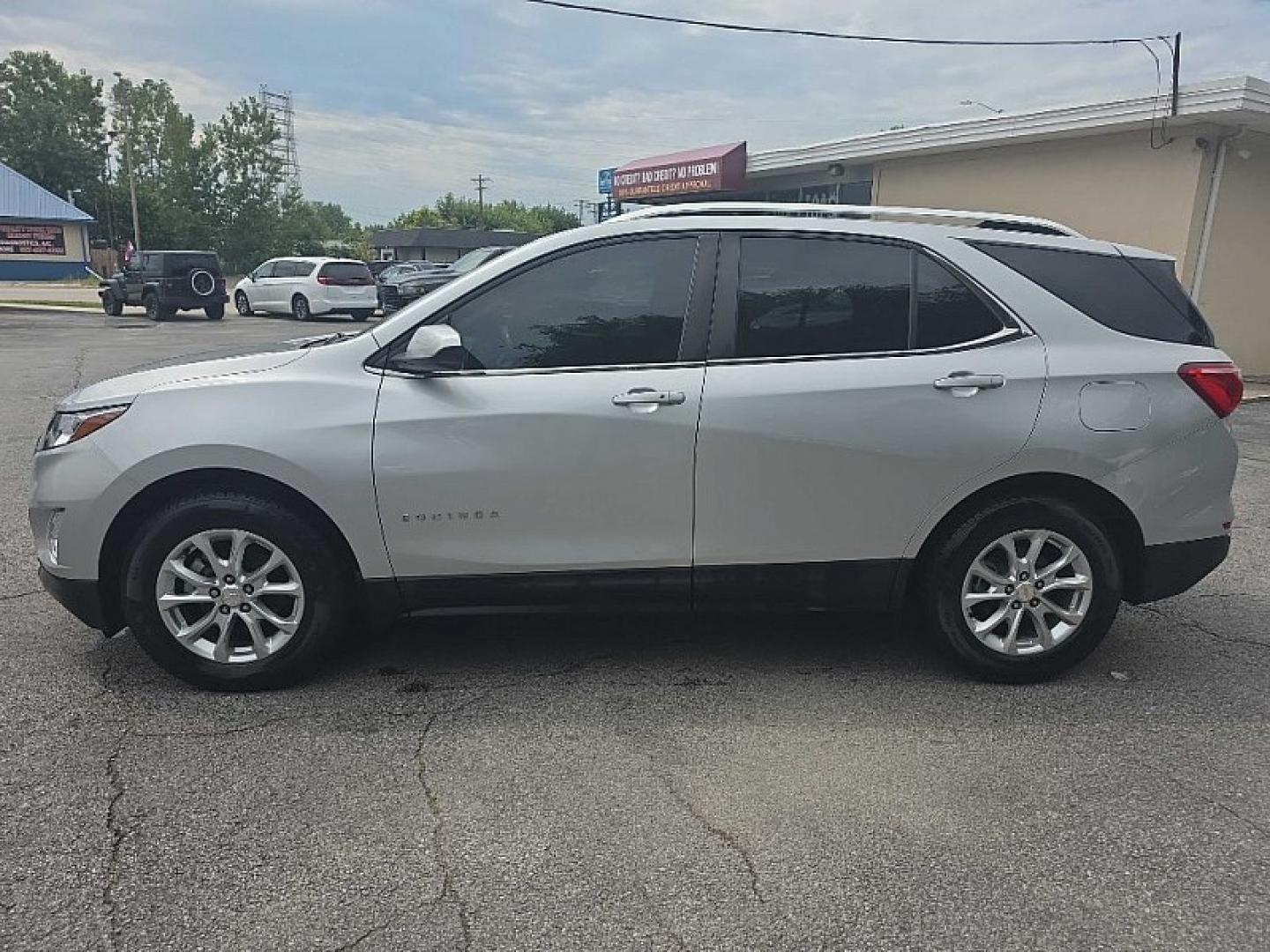 2021 SILVER /BLACK Chevrolet Equinox LT 2WD (3GNAXKEV0MS) with an 1.5L L4 DOHC 16V TURBO engine, 6A transmission, located at 3304 Woodville Road, Northwood, OH, 43619, (419) 210-8019, 41.612694, -83.480743 - Your #1 Destination for Auto Loans and mdash;No Matter Your Credit!At our dealership, we believe everyone deserves the opportunity to drive their dream car and mdash;whether you have good credit, bad credit, or no credit at all. With a wide selection of hundreds of cars, trucks, and SUVs, you'll fin- Photo#1