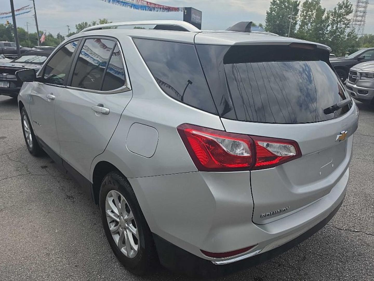 2021 SILVER /BLACK Chevrolet Equinox LT 2WD (3GNAXKEV0MS) with an 1.5L L4 DOHC 16V TURBO engine, 6A transmission, located at 3304 Woodville Road, Northwood, OH, 43619, (419) 210-8019, 41.612694, -83.480743 - Your #1 Destination for Auto Loans and mdash;No Matter Your Credit!At our dealership, we believe everyone deserves the opportunity to drive their dream car and mdash;whether you have good credit, bad credit, or no credit at all. With a wide selection of hundreds of cars, trucks, and SUVs, you'll fin- Photo#2