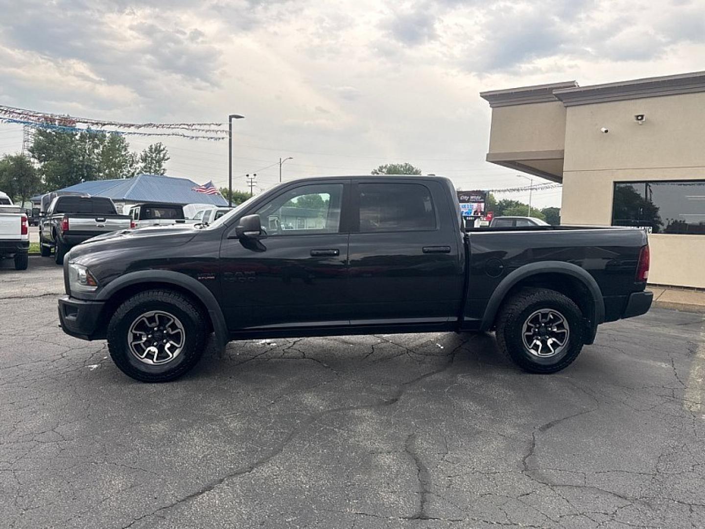 2016 BLACK /BLACK RAM 1500 Rebel Crew Cab SWB 4WD (1C6RR7YT8GS) with an 5.7L V8 OHV 16V engine, 6A transmission, located at 3304 Woodville Road, Northwood, OH, 43619, (419) 210-8019, 41.612694, -83.480743 - Your #1 Destination for Auto Loans and mdash;No Matter Your Credit!At our dealership, we believe everyone deserves the opportunity to drive their dream car and mdash;whether you have good credit, bad credit, or no credit at all. With a wide selection of hundreds of cars, trucks, and SUVs, you'll fin- Photo#1