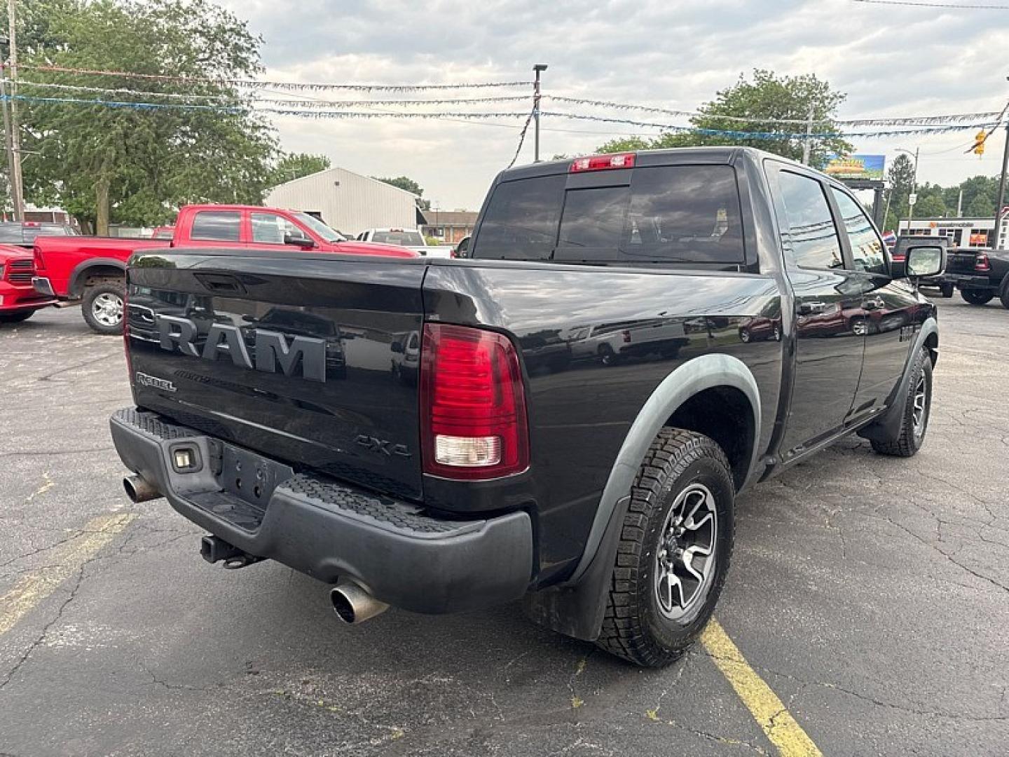 2016 BLACK /BLACK RAM 1500 Rebel Crew Cab SWB 4WD (1C6RR7YT8GS) with an 5.7L V8 OHV 16V engine, 6A transmission, located at 3304 Woodville Road, Northwood, OH, 43619, (419) 210-8019, 41.612694, -83.480743 - Your #1 Destination for Auto Loans and mdash;No Matter Your Credit!At our dealership, we believe everyone deserves the opportunity to drive their dream car and mdash;whether you have good credit, bad credit, or no credit at all. With a wide selection of hundreds of cars, trucks, and SUVs, you'll fin- Photo#4