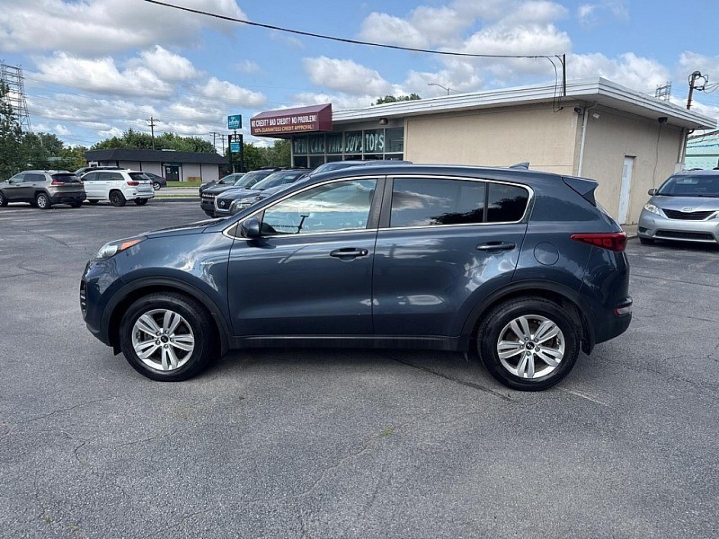 2017 BLUE /BLACK Kia Sportage LX AWD (KNDPMCAC8H7) with an 2.4L V6 DOHC 24V engine, 6A transmission, located at 3304 Woodville Road, Northwood, OH, 43619, (419) 210-8019, 41.612694, -83.480743 - Your #1 Destination for Auto Loans and mdash;No Matter Your Credit!At our dealership, we believe everyone deserves the opportunity to drive their dream car and mdash;whether you have good credit, bad credit, or no credit at all. With a wide selection of hundreds of cars, trucks, and SUVs, you'll fin- Photo#1