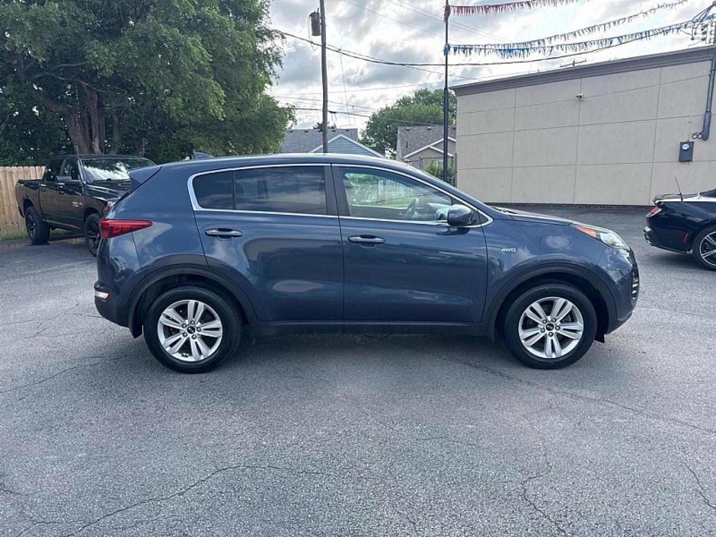 2017 BLUE /BLACK Kia Sportage LX AWD (KNDPMCAC8H7) with an 2.4L V6 DOHC 24V engine, 6A transmission, located at 3304 Woodville Road, Northwood, OH, 43619, (419) 210-8019, 41.612694, -83.480743 - Your #1 Destination for Auto Loans and mdash;No Matter Your Credit!At our dealership, we believe everyone deserves the opportunity to drive their dream car and mdash;whether you have good credit, bad credit, or no credit at all. With a wide selection of hundreds of cars, trucks, and SUVs, you'll fin- Photo#5