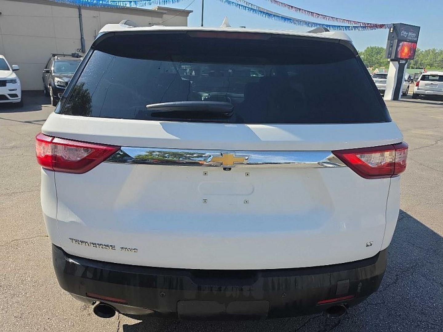 2021 WHITE /BLACK Chevrolet Traverse LT Feather AWD (1GNEVHKW3MJ) with an 3.6L V6 DOHC 24V engine, 9A transmission, located at 3304 Woodville Road, Northwood, OH, 43619, (419) 210-8019, 41.612694, -83.480743 - Your #1 Destination for Auto Loans and mdash;No Matter Your Credit!At our dealership, we believe everyone deserves the opportunity to drive their dream car and mdash;whether you have good credit, bad credit, or no credit at all. With a wide selection of hundreds of cars, trucks, and SUVs, you'll fin- Photo#3
