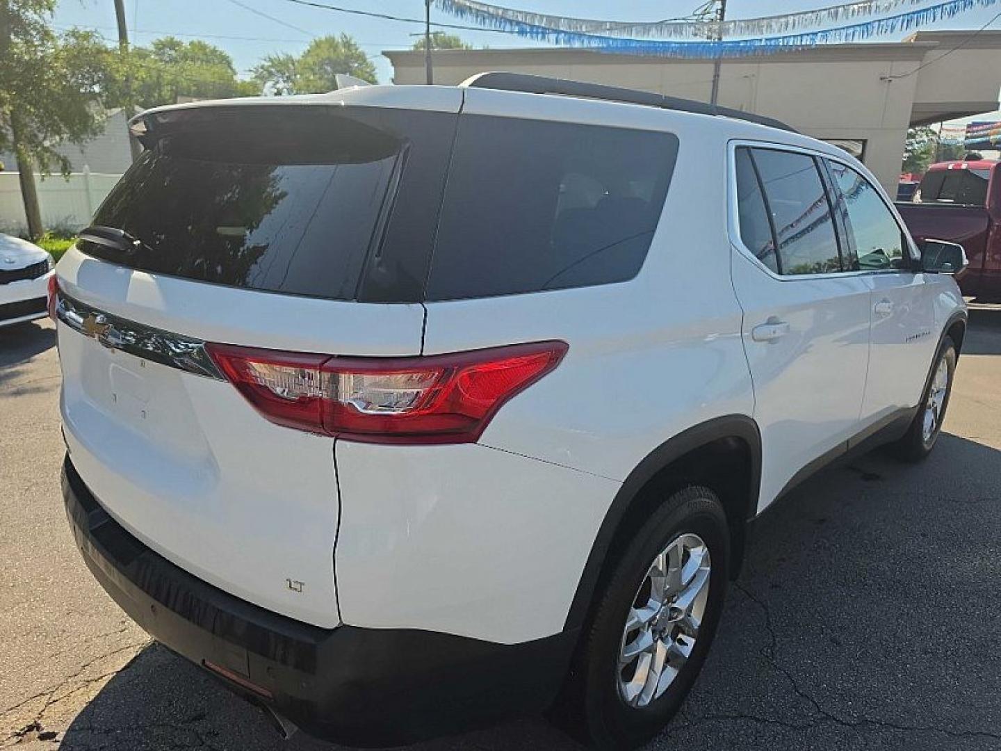 2021 WHITE /BLACK Chevrolet Traverse LT Feather AWD (1GNEVHKW3MJ) with an 3.6L V6 DOHC 24V engine, 9A transmission, located at 3304 Woodville Road, Northwood, OH, 43619, (419) 210-8019, 41.612694, -83.480743 - Your #1 Destination for Auto Loans and mdash;No Matter Your Credit!At our dealership, we believe everyone deserves the opportunity to drive their dream car and mdash;whether you have good credit, bad credit, or no credit at all. With a wide selection of hundreds of cars, trucks, and SUVs, you'll fin- Photo#4