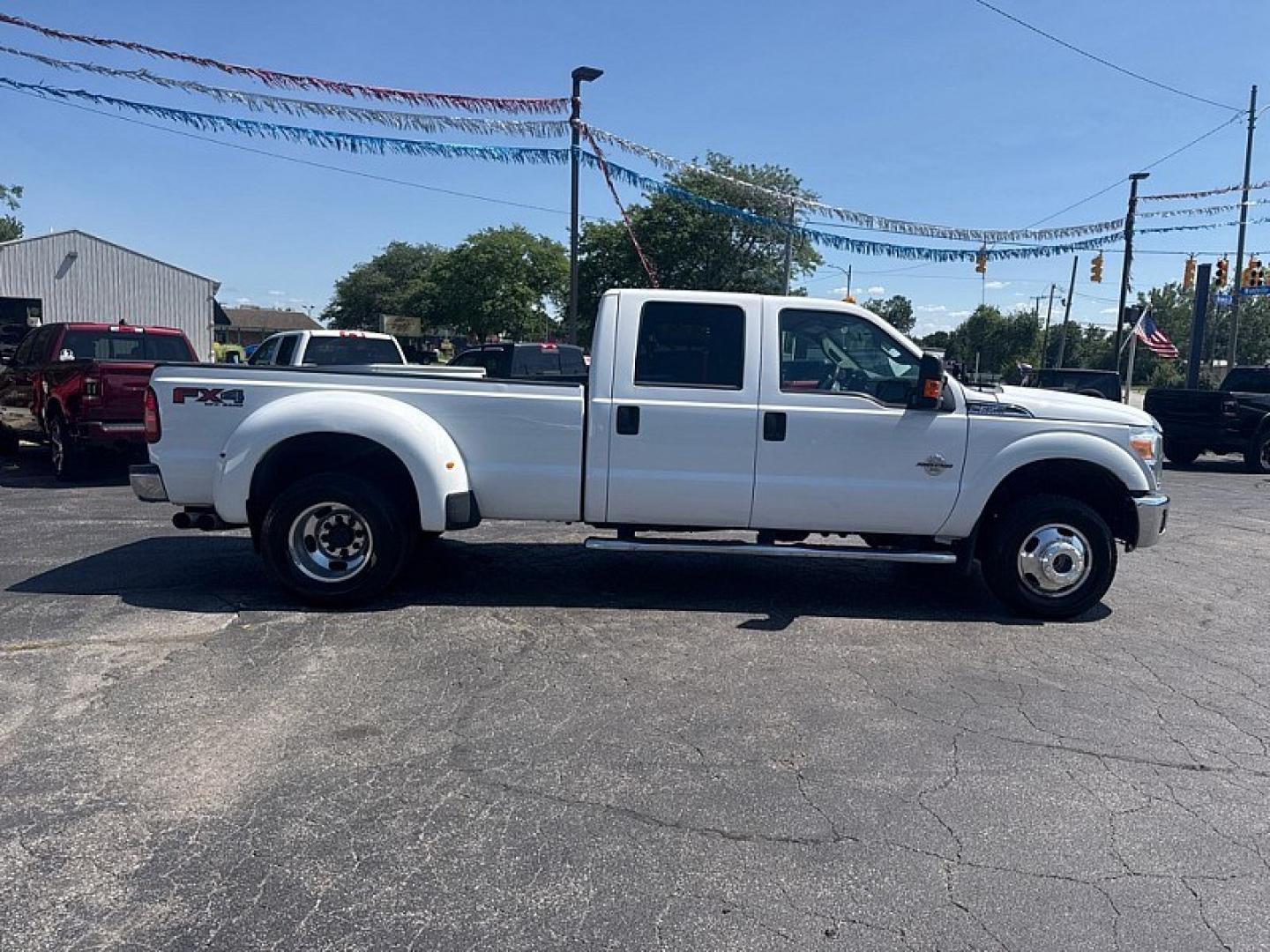 2016 WHITE /GREY Ford F-350 SD King Ranch Crew Cab Long Bed DRW 4WD (1FT8W3DT3GE) with an 6.7L V8 OHV 16V DIESEL engine, 6A transmission, located at 3304 Woodville Road, Northwood, OH, 43619, (419) 210-8019, 41.612694, -83.480743 - Your #1 Destination for Auto Loans and mdash;No Matter Your Credit!At our dealership, we believe everyone deserves the opportunity to drive their dream car and mdash;whether you have good credit, bad credit, or no credit at all. With a wide selection of hundreds of cars, trucks, and SUVs, you'll fin- Photo#5