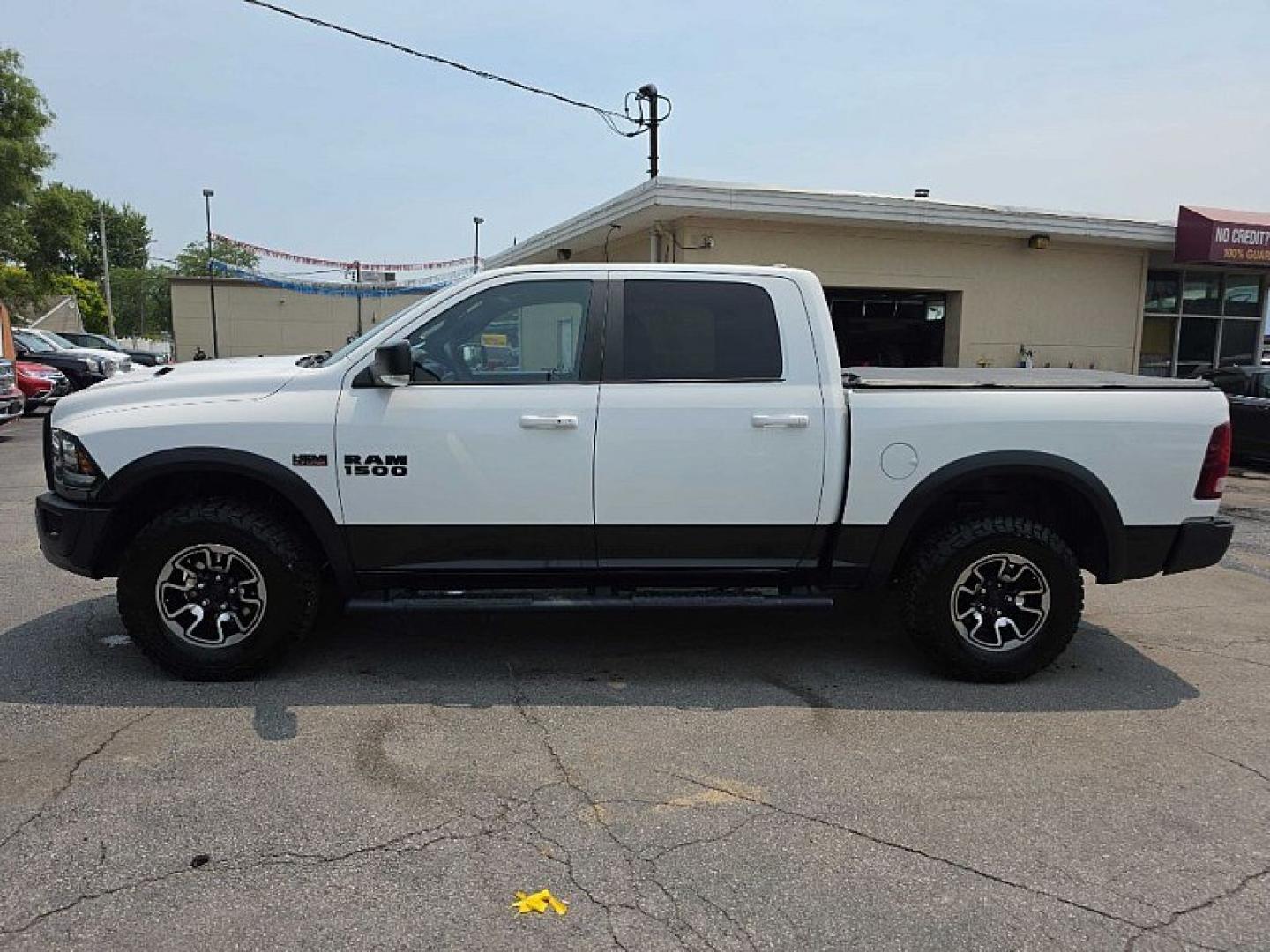2017 WHITE /BLACK/RED RAM 1500 Rebel Crew Cab SWB 4WD (1C6RR7YT6HS) with an 5.7L V8 OHV 16V engine, 8A transmission, located at 3304 Woodville Road, Northwood, OH, 43619, (419) 210-8019, 41.612694, -83.480743 - Your #1 Destination for Auto Loans and mdash;No Matter Your Credit!At our dealership, we believe everyone deserves the opportunity to drive their dream car and mdash;whether you have good credit, bad credit, or no credit at all. With a wide selection of hundreds of cars, trucks, and SUVs, you'll fin- Photo#1