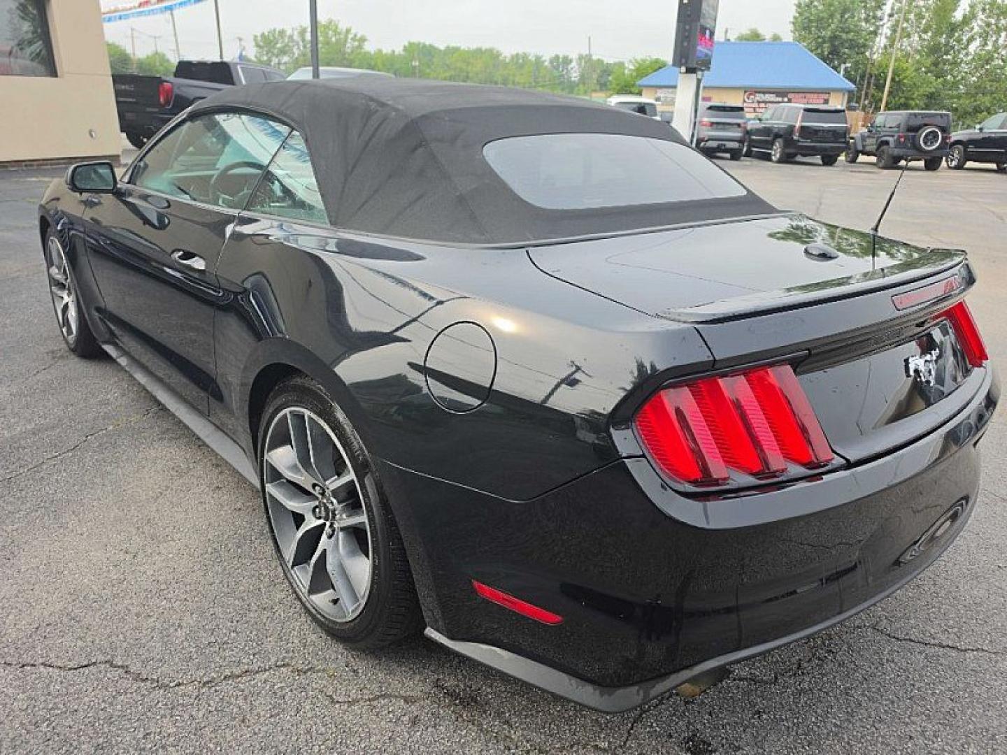 2016 BLACK /BLACK Ford Mustang EcoBoost Premium Convertible (1FATP8UH9G5) with an 2.3L L4 DOHC 16V engine, Auto 6-Spd SelectShift transmission, located at 3304 Woodville Road, Northwood, OH, 43619, (419) 210-8019, 41.612694, -83.480743 - Your #1 Destination for Auto Loans and mdash;No Matter Your Credit!At our dealership, we believe everyone deserves the opportunity to drive their dream car and mdash;whether you have good credit, bad credit, or no credit at all. With a wide selection of hundreds of cars, trucks, and SUVs, you'll fin- Photo#2