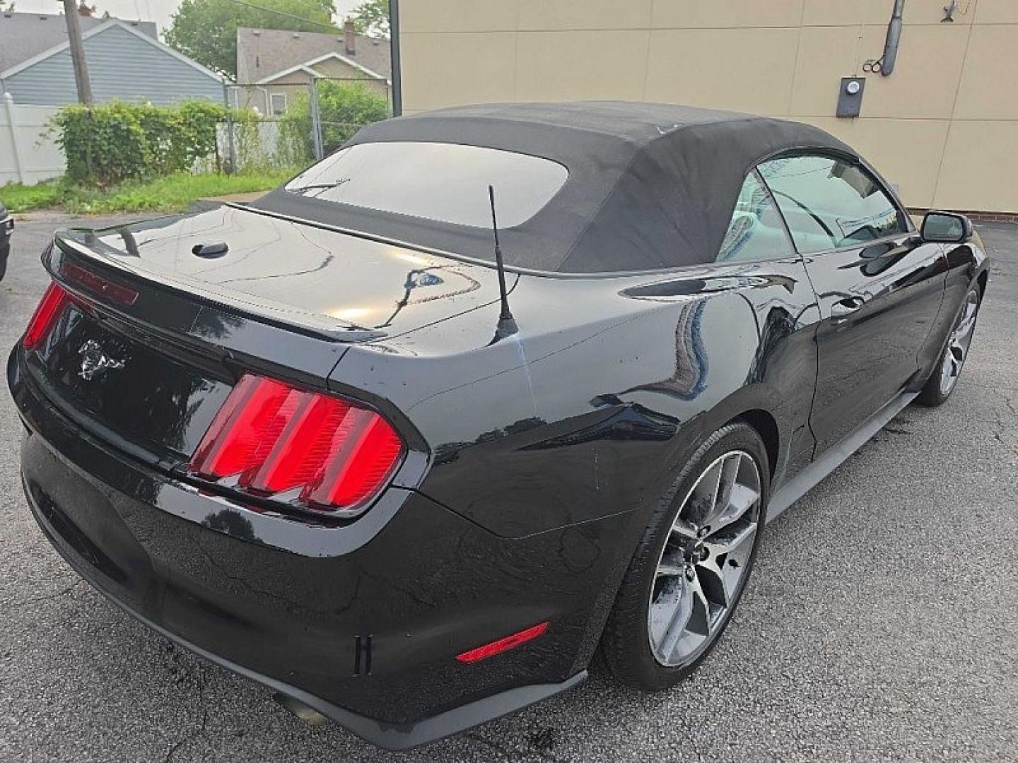 2016 BLACK /BLACK Ford Mustang EcoBoost Premium Convertible (1FATP8UH9G5) with an 2.3L L4 DOHC 16V engine, Auto 6-Spd SelectShift transmission, located at 3304 Woodville Road, Northwood, OH, 43619, (419) 210-8019, 41.612694, -83.480743 - Your #1 Destination for Auto Loans and mdash;No Matter Your Credit!At our dealership, we believe everyone deserves the opportunity to drive their dream car and mdash;whether you have good credit, bad credit, or no credit at all. With a wide selection of hundreds of cars, trucks, and SUVs, you'll fin- Photo#4