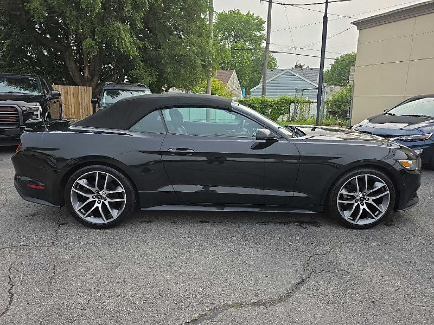 2016 BLACK /BLACK Ford Mustang EcoBoost Premium Convertible (1FATP8UH9G5) with an 2.3L L4 DOHC 16V engine, Auto 6-Spd SelectShift transmission, located at 3304 Woodville Road, Northwood, OH, 43619, (419) 210-8019, 41.612694, -83.480743 - Your #1 Destination for Auto Loans and mdash;No Matter Your Credit!At our dealership, we believe everyone deserves the opportunity to drive their dream car and mdash;whether you have good credit, bad credit, or no credit at all. With a wide selection of hundreds of cars, trucks, and SUVs, you'll fin- Photo#5