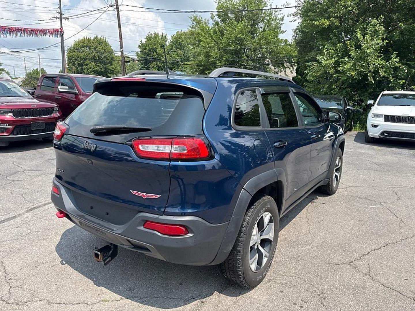 2018 BLUE /BLACK Jeep Cherokee Trailhawk 4WD (1C4PJMBBXJD) with an 2.4L L4 DOHC 16V engine, 9A transmission, located at 3304 Woodville Road, Northwood, OH, 43619, (419) 210-8019, 41.612694, -83.480743 - Your #1 Destination for Auto Loans and mdash;No Matter Your Credit!At our dealership, we believe everyone deserves the opportunity to drive their dream car and mdash;whether you have good credit, bad credit, or no credit at all. With a wide selection of hundreds of cars, trucks, and SUVs, you'll fin- Photo#4