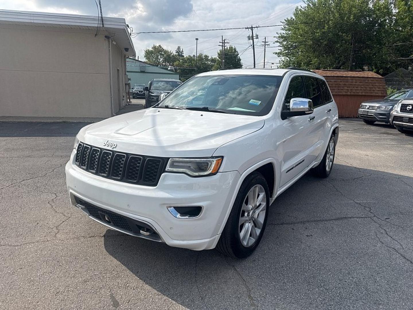 2017 WHITE /BLACK Jeep Grand Cherokee Overland 4WD (1C4RJFCG0HC) with an 3.6L V6 DOHC 24V engine, 8A transmission, located at 3304 Woodville Road, Northwood, OH, 43619, (419) 210-8019, 41.612694, -83.480743 - Your #1 Destination for Auto Loans and mdash;No Matter Your Credit!At our dealership, we believe everyone deserves the opportunity to drive their dream car and mdash;whether you have good credit, bad credit, or no credit at all. With a wide selection of hundreds of cars, trucks, and SUVs, you'll fin- Photo#0