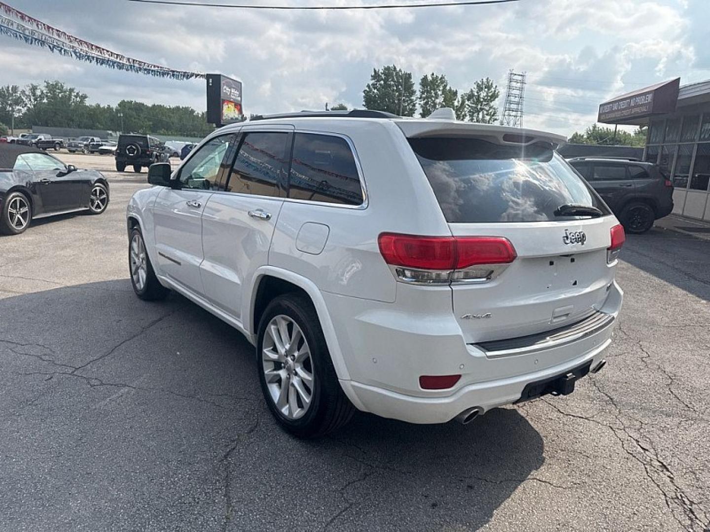 2017 WHITE /BLACK Jeep Grand Cherokee Overland 4WD (1C4RJFCG0HC) with an 3.6L V6 DOHC 24V engine, 8A transmission, located at 3304 Woodville Road, Northwood, OH, 43619, (419) 210-8019, 41.612694, -83.480743 - Your #1 Destination for Auto Loans and mdash;No Matter Your Credit!At our dealership, we believe everyone deserves the opportunity to drive their dream car and mdash;whether you have good credit, bad credit, or no credit at all. With a wide selection of hundreds of cars, trucks, and SUVs, you'll fin- Photo#2