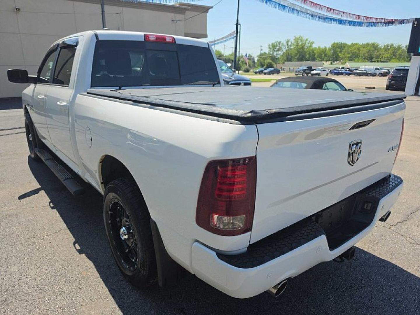 2016 WHITE /BLACK RAM 1500 Sport Crew Cab LWB 4WD (1C6RR7UT9GS) with an 5.7L V8 OHV 16V engine, 6A transmission, located at 3304 Woodville Road, Northwood, OH, 43619, (419) 210-8019, 41.612694, -83.480743 - Your #1 Destination for Auto Loans and mdash;No Matter Your Credit!At our dealership, we believe everyone deserves the opportunity to drive their dream car and mdash;whether you have good credit, bad credit, or no credit at all. With a wide selection of hundreds of cars, trucks, and SUVs, you'll fin- Photo#2