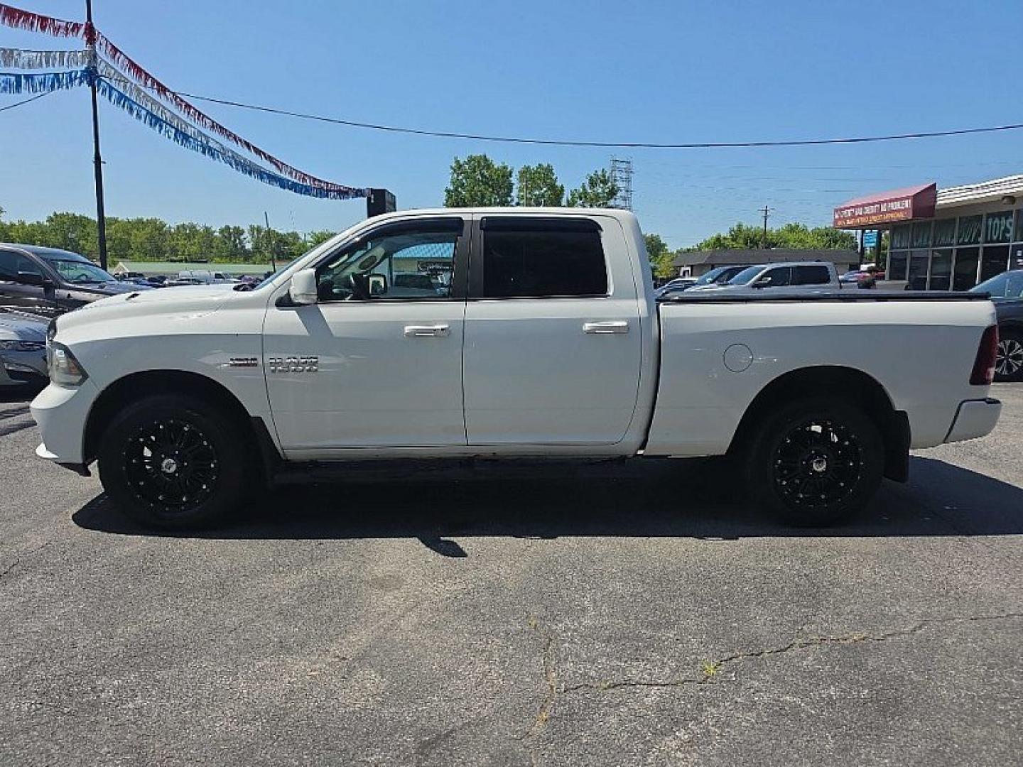 2016 WHITE /BLACK RAM 1500 Sport Crew Cab LWB 4WD (1C6RR7UT9GS) with an 5.7L V8 OHV 16V engine, 6A transmission, located at 3304 Woodville Road, Northwood, OH, 43619, (419) 210-8019, 41.612694, -83.480743 - Your #1 Destination for Auto Loans and mdash;No Matter Your Credit!At our dealership, we believe everyone deserves the opportunity to drive their dream car and mdash;whether you have good credit, bad credit, or no credit at all. With a wide selection of hundreds of cars, trucks, and SUVs, you'll fin- Photo#1