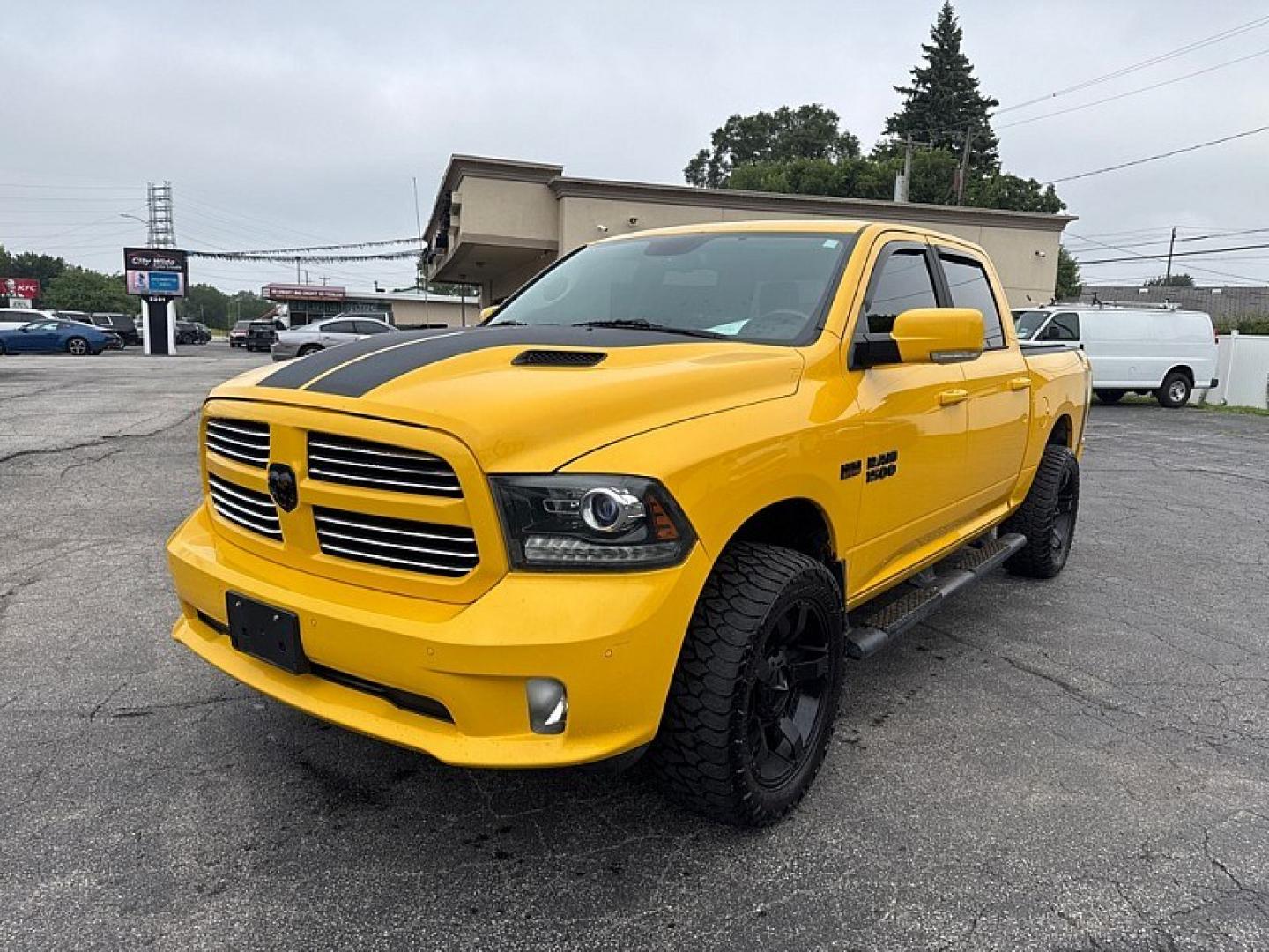 2016 YELLOW /BLACK RAM 1500 Sport Crew Cab SWB 4WD (1C6RR7MT1GS) with an 5.7L V8 OHV 16V engine, 6A transmission, located at 3304 Woodville Road, Northwood, OH, 43619, (419) 210-8019, 41.612694, -83.480743 - Your #1 Destination for Auto Loans and mdash;No Matter Your Credit!At our dealership, we believe everyone deserves the opportunity to drive their dream car and mdash;whether you have good credit, bad credit, or no credit at all. With a wide selection of hundreds of cars, trucks, and SUVs, you'll fin- Photo#0