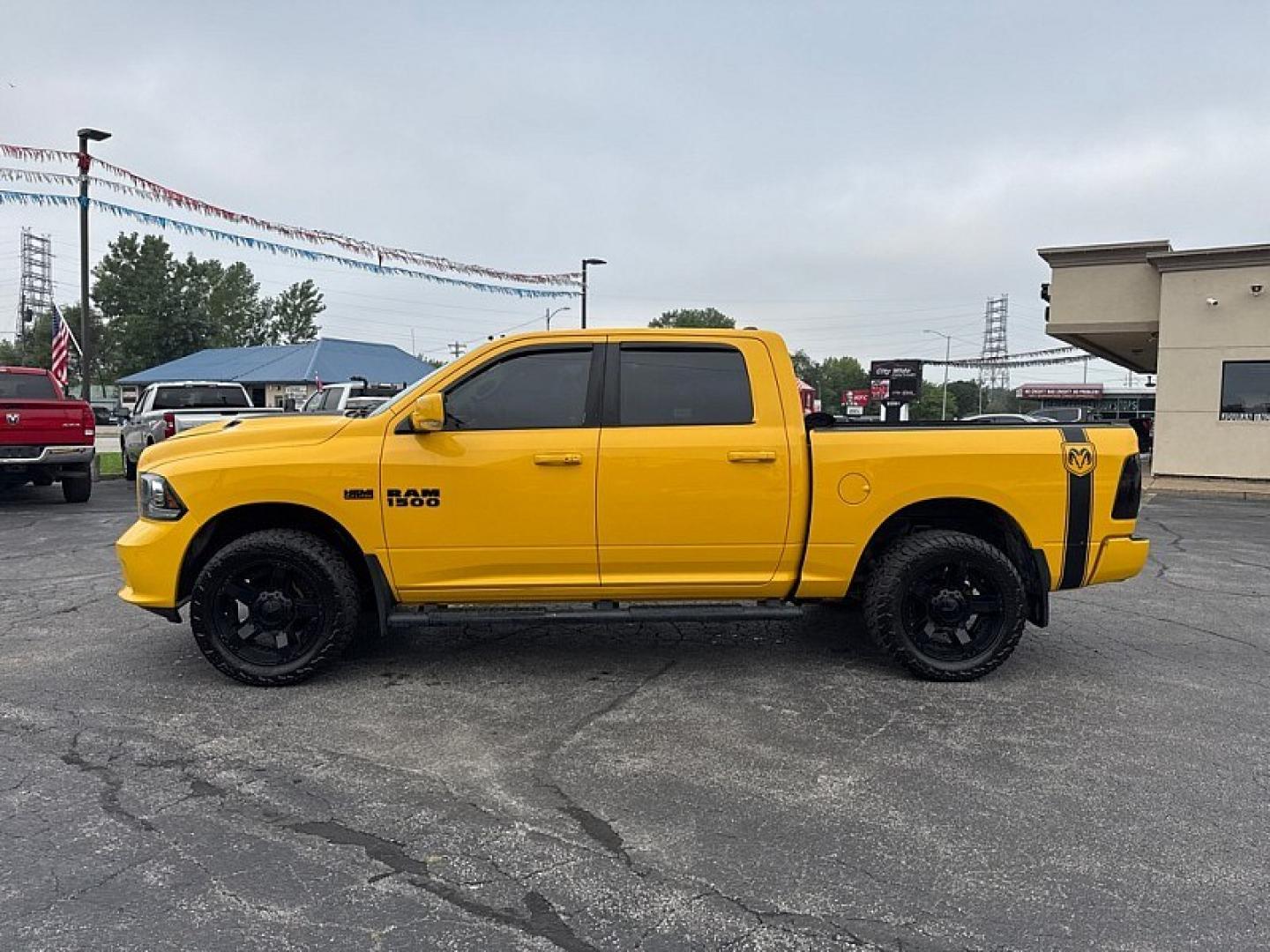 2016 YELLOW /BLACK RAM 1500 Sport Crew Cab SWB 4WD (1C6RR7MT1GS) with an 5.7L V8 OHV 16V engine, 6A transmission, located at 3304 Woodville Road, Northwood, OH, 43619, (419) 210-8019, 41.612694, -83.480743 - Your #1 Destination for Auto Loans and mdash;No Matter Your Credit!At our dealership, we believe everyone deserves the opportunity to drive their dream car and mdash;whether you have good credit, bad credit, or no credit at all. With a wide selection of hundreds of cars, trucks, and SUVs, you'll fin- Photo#1