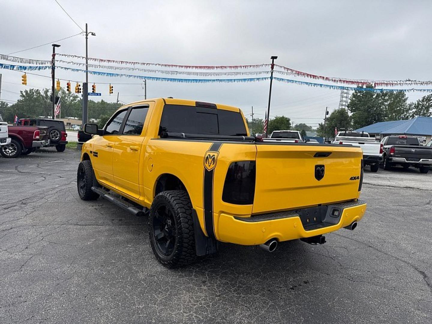 2016 YELLOW /BLACK RAM 1500 Sport Crew Cab SWB 4WD (1C6RR7MT1GS) with an 5.7L V8 OHV 16V engine, 6A transmission, located at 3304 Woodville Road, Northwood, OH, 43619, (419) 210-8019, 41.612694, -83.480743 - Your #1 Destination for Auto Loans and mdash;No Matter Your Credit!At our dealership, we believe everyone deserves the opportunity to drive their dream car and mdash;whether you have good credit, bad credit, or no credit at all. With a wide selection of hundreds of cars, trucks, and SUVs, you'll fin- Photo#2
