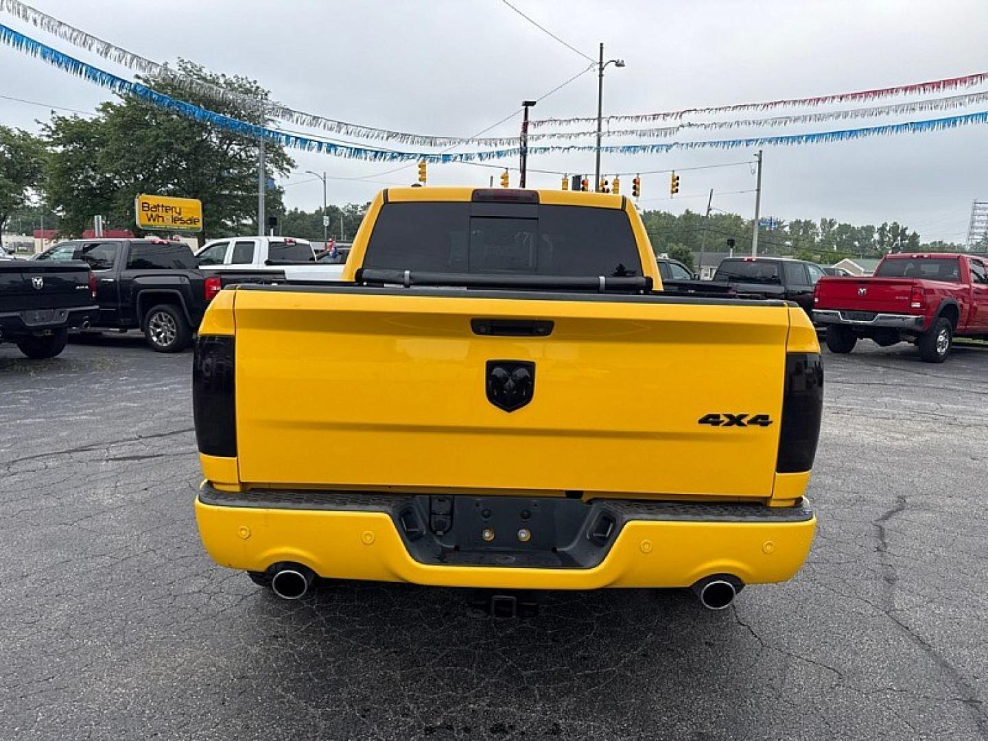 2016 YELLOW /BLACK RAM 1500 Sport Crew Cab SWB 4WD (1C6RR7MT1GS) with an 5.7L V8 OHV 16V engine, 6A transmission, located at 3304 Woodville Road, Northwood, OH, 43619, (419) 210-8019, 41.612694, -83.480743 - Your #1 Destination for Auto Loans and mdash;No Matter Your Credit!At our dealership, we believe everyone deserves the opportunity to drive their dream car and mdash;whether you have good credit, bad credit, or no credit at all. With a wide selection of hundreds of cars, trucks, and SUVs, you'll fin- Photo#3