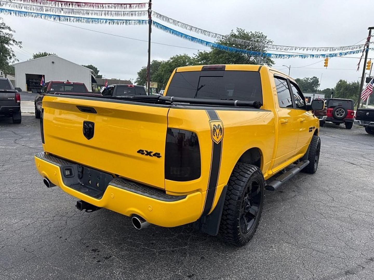 2016 YELLOW /BLACK RAM 1500 Sport Crew Cab SWB 4WD (1C6RR7MT1GS) with an 5.7L V8 OHV 16V engine, 6A transmission, located at 3304 Woodville Road, Northwood, OH, 43619, (419) 210-8019, 41.612694, -83.480743 - Your #1 Destination for Auto Loans and mdash;No Matter Your Credit!At our dealership, we believe everyone deserves the opportunity to drive their dream car and mdash;whether you have good credit, bad credit, or no credit at all. With a wide selection of hundreds of cars, trucks, and SUVs, you'll fin- Photo#4