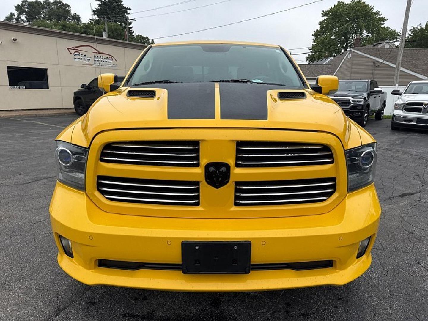 2016 YELLOW /BLACK RAM 1500 Sport Crew Cab SWB 4WD (1C6RR7MT1GS) with an 5.7L V8 OHV 16V engine, 6A transmission, located at 3304 Woodville Road, Northwood, OH, 43619, (419) 210-8019, 41.612694, -83.480743 - Your #1 Destination for Auto Loans and mdash;No Matter Your Credit!At our dealership, we believe everyone deserves the opportunity to drive their dream car and mdash;whether you have good credit, bad credit, or no credit at all. With a wide selection of hundreds of cars, trucks, and SUVs, you'll fin- Photo#7