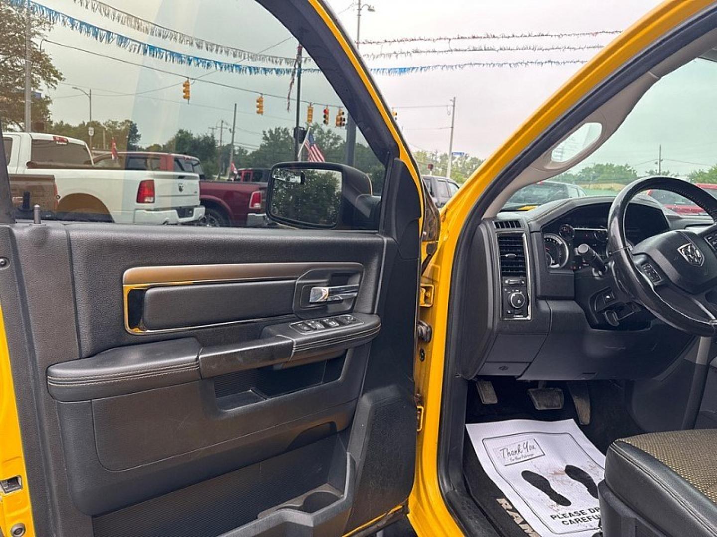 2016 YELLOW /BLACK RAM 1500 Sport Crew Cab SWB 4WD (1C6RR7MT1GS) with an 5.7L V8 OHV 16V engine, 6A transmission, located at 3304 Woodville Road, Northwood, OH, 43619, (419) 210-8019, 41.612694, -83.480743 - Your #1 Destination for Auto Loans and mdash;No Matter Your Credit!At our dealership, we believe everyone deserves the opportunity to drive their dream car and mdash;whether you have good credit, bad credit, or no credit at all. With a wide selection of hundreds of cars, trucks, and SUVs, you'll fin- Photo#8