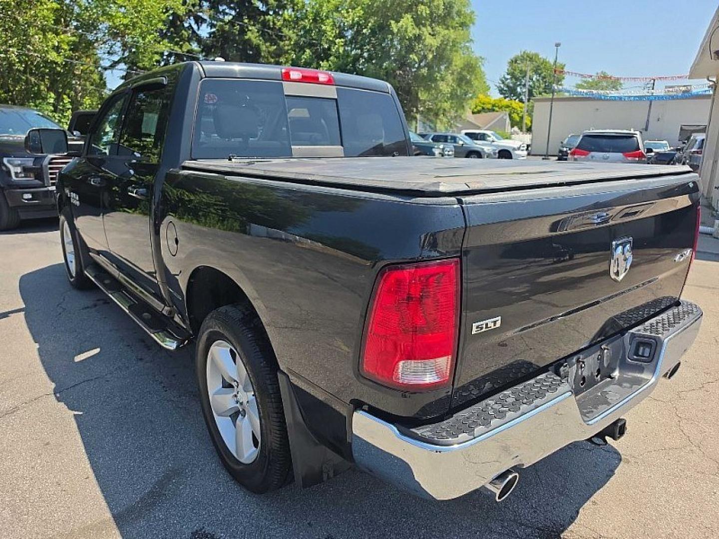 2017 BLACK /GRAY RAM 1500 SLT Crew Cab SWB 4WD (1C6RR7LT0HS) with an 5.7L V8 OHV 16V engine, 8A transmission, located at 3304 Woodville Road, Northwood, OH, 43619, (419) 210-8019, 41.612694, -83.480743 - Your #1 Destination for Auto Loans and mdash;No Matter Your Credit!At our dealership, we believe everyone deserves the opportunity to drive their dream car and mdash;whether you have good credit, bad credit, or no credit at all. With a wide selection of hundreds of cars, trucks, and SUVs, you'll fin- Photo#2