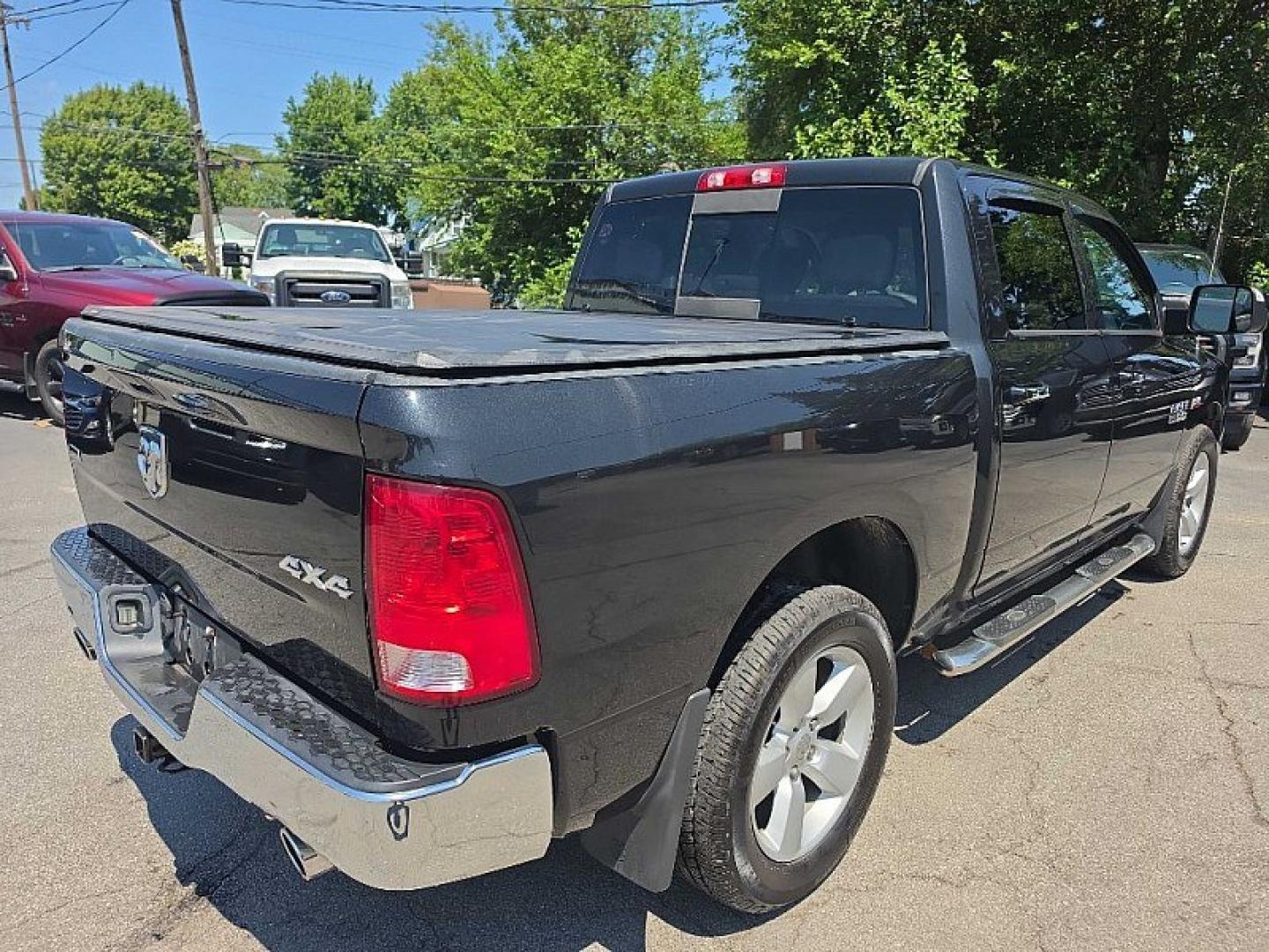 2017 BLACK /GRAY RAM 1500 SLT Crew Cab SWB 4WD (1C6RR7LT0HS) with an 5.7L V8 OHV 16V engine, 8A transmission, located at 3304 Woodville Road, Northwood, OH, 43619, (419) 210-8019, 41.612694, -83.480743 - Your #1 Destination for Auto Loans and mdash;No Matter Your Credit!At our dealership, we believe everyone deserves the opportunity to drive their dream car and mdash;whether you have good credit, bad credit, or no credit at all. With a wide selection of hundreds of cars, trucks, and SUVs, you'll fin- Photo#4