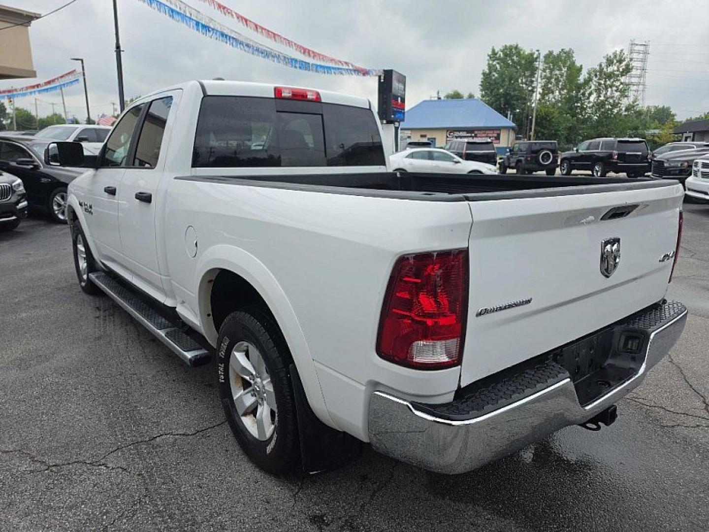 2015 WHITE /GRAY RAM 1500 SLT Quad Cab 4WD (1C6RR7GT7FS) with an 5.7L V8 OHV 16V engine, 6-Speed Automatic transmission, located at 3304 Woodville Road, Northwood, OH, 43619, (419) 210-8019, 41.612694, -83.480743 - Your #1 Destination for Auto Loans and mdash;No Matter Your Credit!At our dealership, we believe everyone deserves the opportunity to drive their dream car and mdash;whether you have good credit, bad credit, or no credit at all. With a wide selection of hundreds of cars, trucks, and SUVs, you'll fin- Photo#2