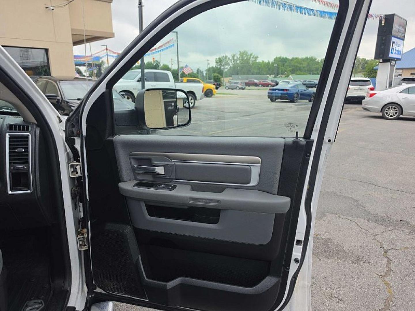 2015 WHITE /GRAY RAM 1500 SLT Quad Cab 4WD (1C6RR7GT7FS) with an 5.7L V8 OHV 16V engine, 6-Speed Automatic transmission, located at 3304 Woodville Road, Northwood, OH, 43619, (419) 210-8019, 41.612694, -83.480743 - Your #1 Destination for Auto Loans and mdash;No Matter Your Credit!At our dealership, we believe everyone deserves the opportunity to drive their dream car and mdash;whether you have good credit, bad credit, or no credit at all. With a wide selection of hundreds of cars, trucks, and SUVs, you'll fin- Photo#16